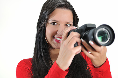 青年妇女手持照相机 拍摄与世隔绝的相片微笑女孩成人照片红色成功单反白色相机商业图片