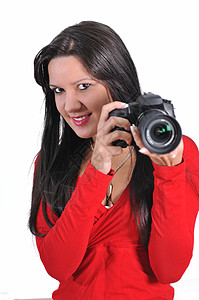 青年妇女手持照相机 拍摄与世隔绝的相片照片幸福女性单反乐趣成功工作喜悦技术红色图片