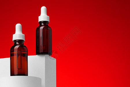 红底带管子的美容油瓶吸管瓶子红色静物香味温泉产品背景滴管按摩图片