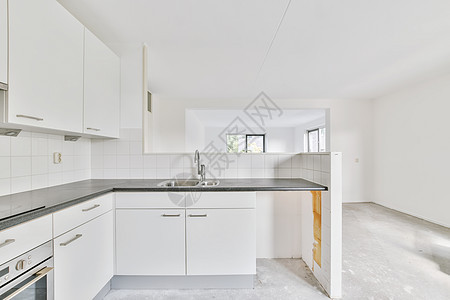 明亮的Kkkitechen岛 在优雅的房子改造地面石膏板厨房桌子财产家装维修建筑学住宅图片