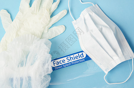 个人防护装备 PPE 蓝色背景的一次性面罩 面罩和手套图片