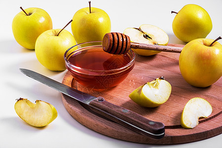 新鲜的成熟整齐 用蜂蜜切黄苹果季节食品蜜蜂健康饮食收成砧板团体水果食物图片