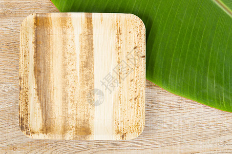 由棕榈 天然材料干贝泰尔坚果树叶制成的炊具盘子叶子食物产品气候包装杯子植物环境厨具图片