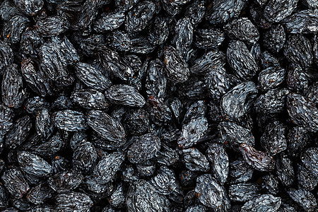 黑葡萄素质地 流行的干果 干葡萄脱水食物团体营养水果烹饪盘子维生素葡萄干小吃背景图片