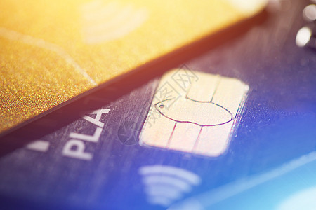 使用信用卡 无接触付款的低关键宏观镜头交易现金塑料芯片银行帐户借方取款机安全蓝色图片