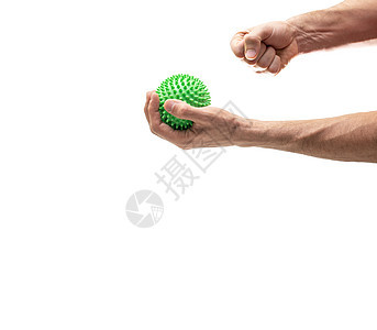 手握着有脊椎的球体 右拳把球击成白色图片