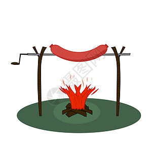 大香肠在烤着火的喷口水上 香肠在有柴火的转子店里撒香肠图片