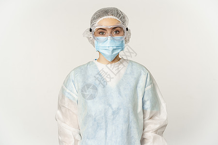 医生 身穿个人防护设备的女性护士的肖像 以自信和专业精神看 站在白色背景之上在白面上站立成人看门人诊所卫生黑发女孩医院职业横幅女图片