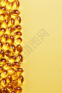 装有Omega3型鱼油 黄色背景和文字位置的罐壳中的胶囊药店产品药品药物营养养分处方药剂饮食鱼油图片