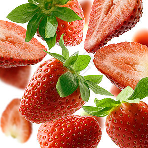 在白色背景上隔离的草莓密闭飞行团体甜点营养水果悬浮浆果宏观绿色红色图片