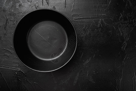 空黑碗 有文字或食物的复制空间 有文字或食物的复制空间 顶视图平躺 黑色深石桌背景盘子石头圆形餐具纹理桌子陶瓷制品图片