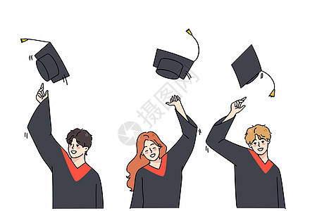 兴奋的学生们在庆祝毕业时把帽子扔到空气中图片