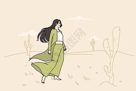 年轻妇女独自在沙漠中游荡图片