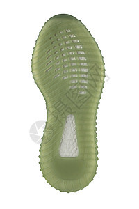 鞋的聚氨酯底部是绿色的 有白条纹图片