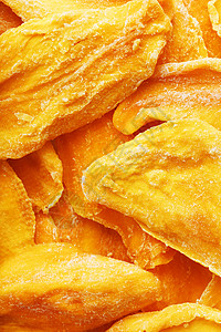 甜意干芒果片 作为全屏背景的近身纹理情调异国饮食营养小吃食物热带甜点蔬菜图片