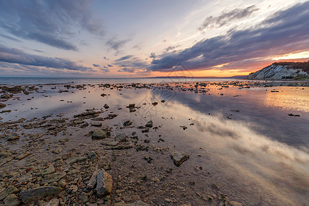 保加利亚黑海海岸的岩石海岸令人振奋的夕阳风景支撑旅行辉光海景巨石天空日出石头日落海岸线图片