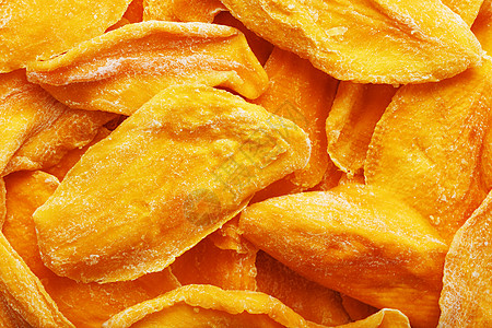 甜意干芒果片 作为全屏背景的近身蔬菜团体市场纹理情调小吃脱水饮食热带橙子图片