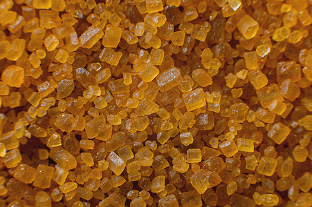 极巨宏 糖晶体 飞机上棕色甘蔗糖的近身 褐色糖的纹理或背景葡萄糖糖果水晶蔗糖活力食物健康饮食黄色颗粒状图片