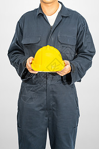 站在蓝色封面上站着的工人 都拿着硬帽工程师建筑师男性工作室安全帽子导师工作服制造业技术员背景图片