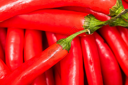 炽热的辣椒起来 红辣椒的背景美食厨房蔬菜食物烹饪燃烧香料红色胡椒植物图片