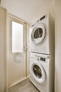 一个小角落 一个舒适住宅公寓洗衣房的洗衣间风格架子建筑师水平房子地面机器家具建筑学财产图片