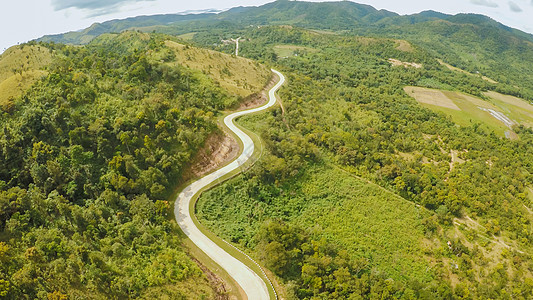 一条长长而曲折的道路穿过绿山 布苏安加岛 科隆 空中视线 菲律宾车道风景国家天空天线阳光摄影曲线嘉年华森林图片