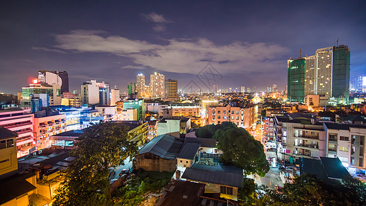 马尼拉市马卡提摩天大楼的时空景象 菲律宾夜间有天线市中心全景高视角高峰旅行摩天大楼交通首都吸引力购物图片