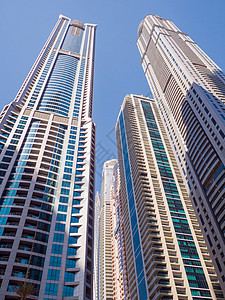 迪拜市蓝色天空的高楼摩天大楼 UAE酒店码头城市建筑学景观场景商业市中心酋长旅行图片