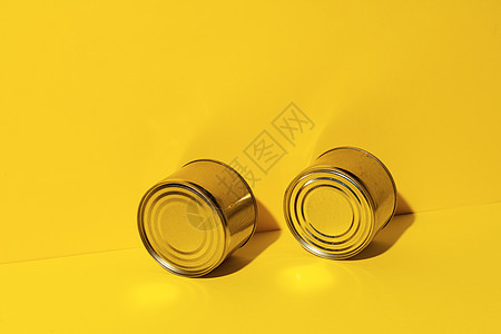 黄色工作室背景的罐罐罐食品锡容器贮存圆柱罐装对象金属店铺锡罐灰色保鲜背景图片