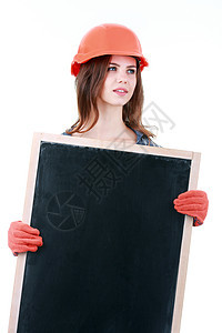 年轻女性建筑商佩戴头盔 手持空白横幅的照片建筑学安全工人建设者女孩帽子标语建筑师商业安全帽图片