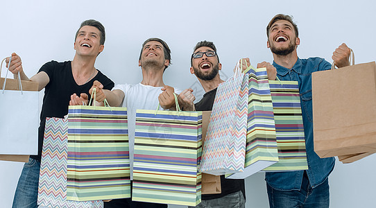 一群带着购物袋的快乐年轻朋友销售购物者店铺购物中心男人乐趣友谊朋友们伙计们成人图片