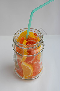 甜黄色和橙色果冻糖 以柠檬和橘子片的形式在罐子里吃图片