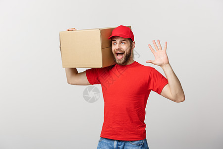 送货员做惊喜手势 拿着纸板盒男性幸福成人邮政盒子工人工作纸板导游男人图片