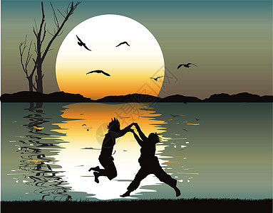 两个孩子在日落时跳舞图片
