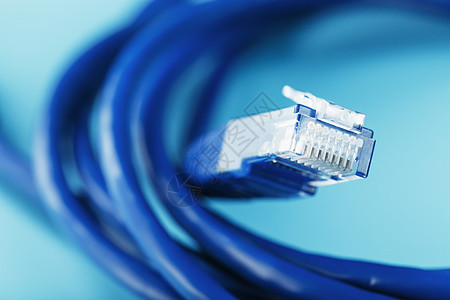 蓝色背景上用于数据传输的互联网网络电缆线圈局域网带宽宽带宏观连接器服务器电讯金属电脑技术图片