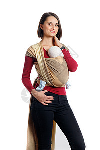 婴儿身着有吸引力的年轻母亲 在编织包装携带者中生儿育女;自由手和积极的母性概念思想图片