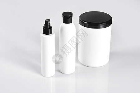 一套装在白色容器中的化妆品 放在浅色背景上面具生活美容呵护包装面膜塑料玻璃皮肤科治疗图片