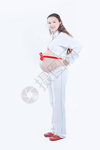 肚子上绑着红丝带的孕妇幸福保健父母药品家庭磁带婴儿女性生活女孩图片