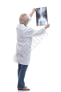 女医生对病人的X光片进行剖面检查知识女性人员职员药品保险眼镜女士护理权限图片