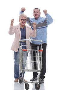 幸福的已婚夫妇和购物车一起开来成人男人眼镜夫妻女士丈夫牛仔裤男性店铺手势图片