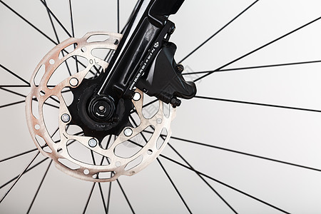 与液压高速公路制动系统连接的自行车刹车旋转器框架磁盘车轮摩擦娱乐齿轮技术转子安全圆圈背景图片