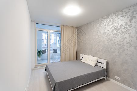 白色内装有灰色床单纺织品房子设计师家具卧室地面软垫装饰公寓风格图片