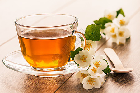 一杯绿色茶 加白茉莉花草本植物玻璃医疗药品杯子白色饮食植物早餐草本图片