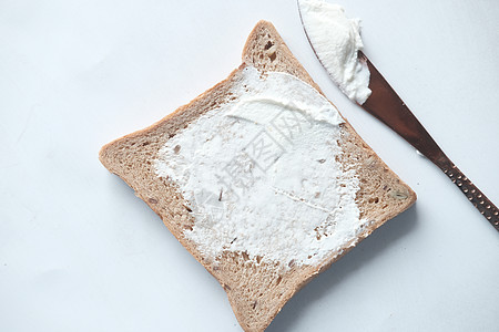 事实上 低乳酪奶油 分散在面包上熟食乳白色营养烹饪奶油状生活图片