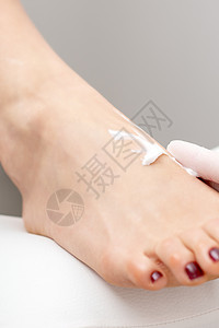 白手套按摩乳霜的妇科医生赤脚呵护保湿修脚师沙龙洗剂皮肤化妆品奶油化妆师图片