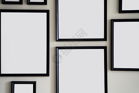 灰墙上挂着不同尺寸的相片 装模作样艺术剪裁办公室小样装饰收藏海报正方形相框摄影图片