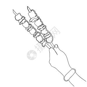 手握着用芝麻烤肉串制成的树枝图片