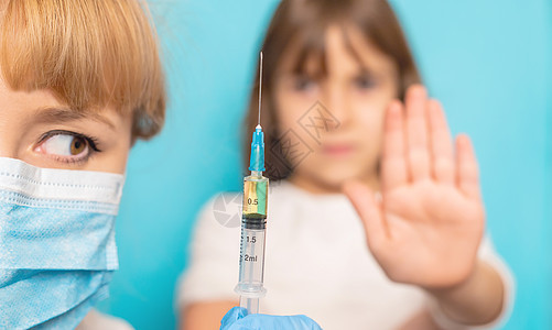儿童被注射到手臂上 有选择的焦点注射器卫生病人疫苗疾病医生儿科保健婴儿感染图片