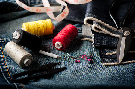 靛青缝纫棉布纺织品帆布牛仔裤织物机器裁缝材料服装裙子背景
