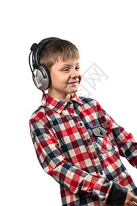 带耳机的男孩音乐衬衫技术幸福喜悦微笑男性白色乐趣童年图片